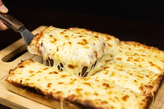 Chicago Deep Dish Pizza takeout service in Calgary - authentic deep dish pizza and wings pickup on 32 St NE