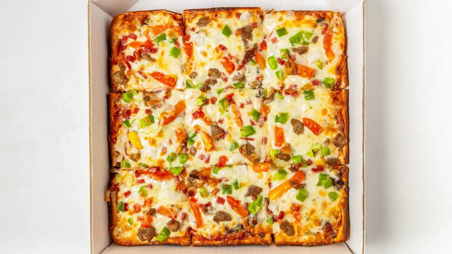 Mr. Universe Pizza at Chicago Deep Dish Pizza Calgary - signature specialty loaded with premium toppings