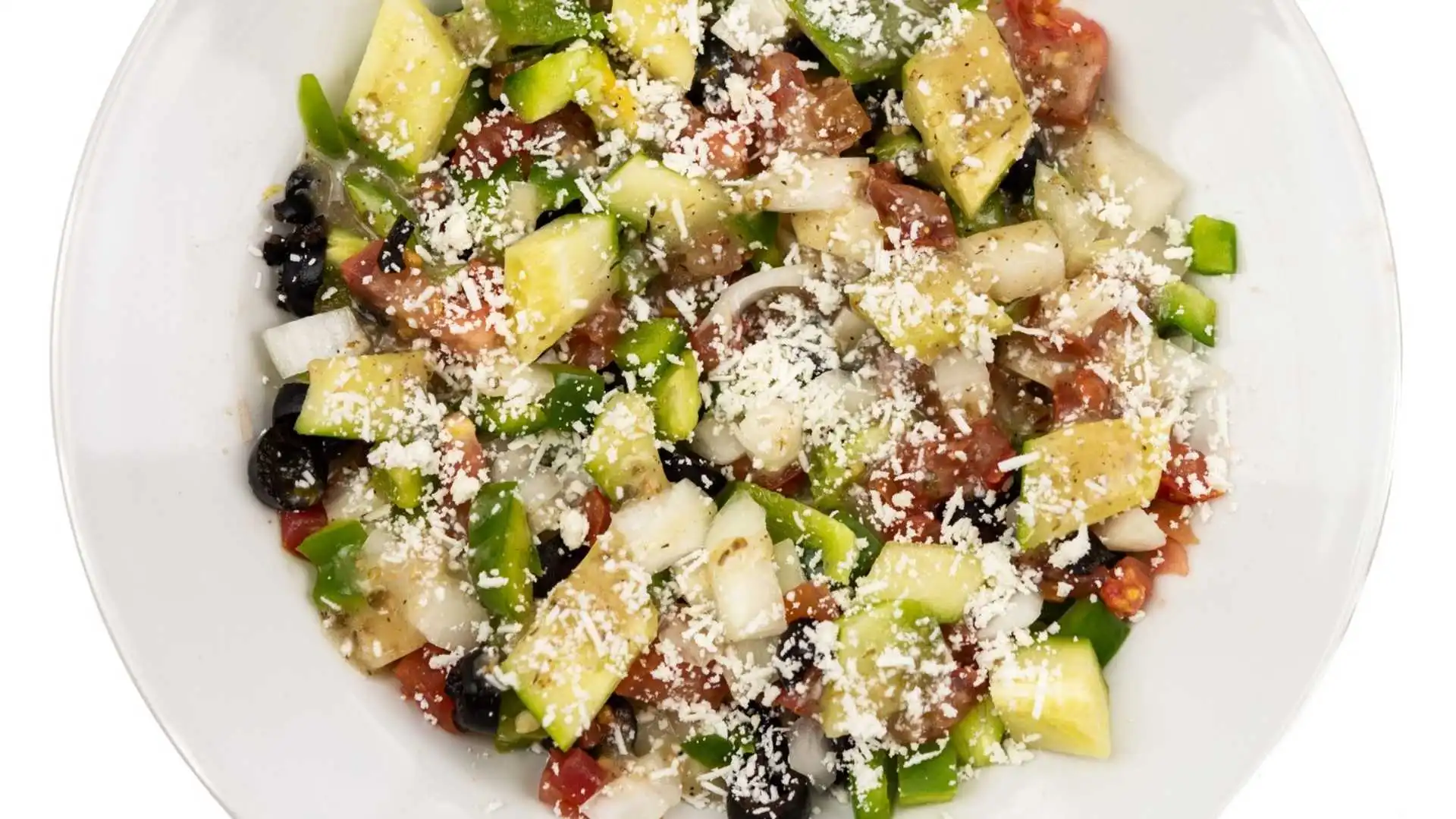 Greek Salad at Chicago Deep Dish Pizza Calgary - fresh salad with tomatoes, cucumbers, olives, feta cheese
